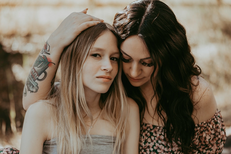 mom hugs daughter captured during photoshoot by bella luna photography