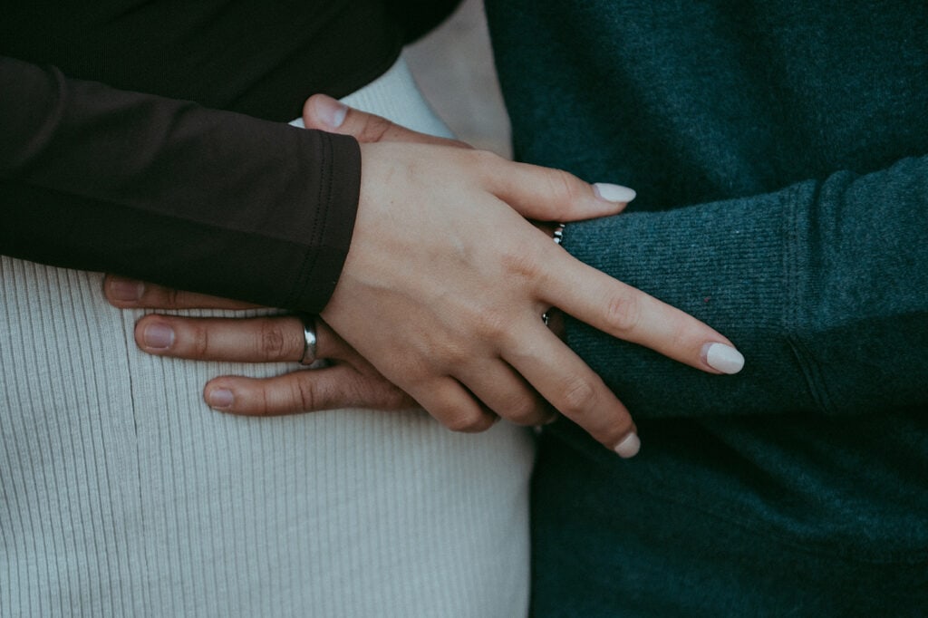 mom and dad holding hands during a family photoshoot at Morven Park in Leesburg VA, by loudoun county family photographer Bella Luna Family Photography